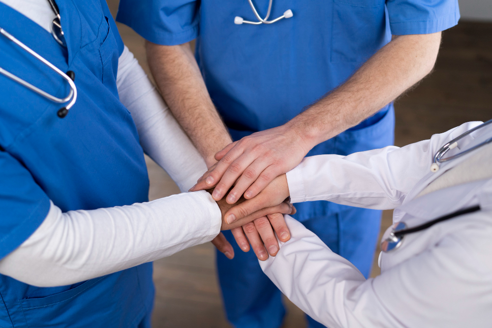Three healthcare professionals hands