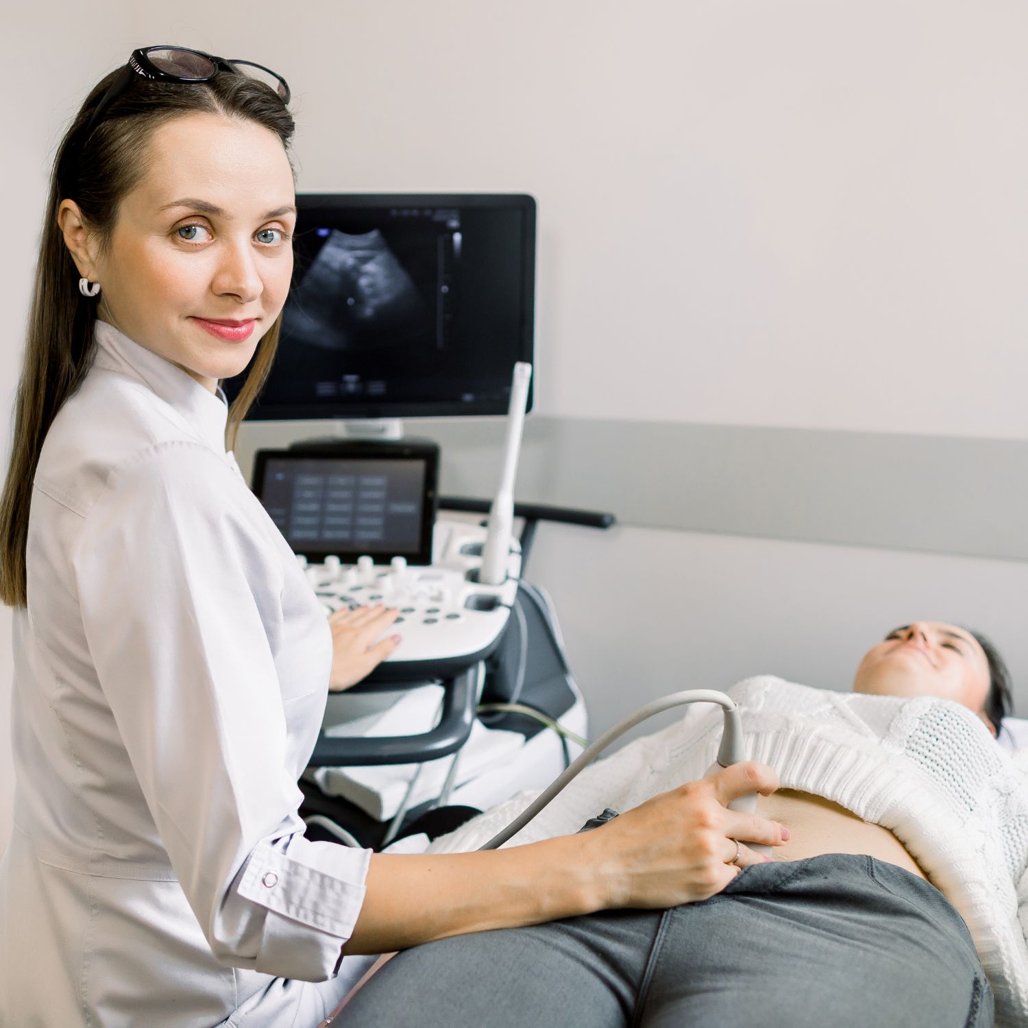 Abdominal ultrasound scan for female patient by doctor