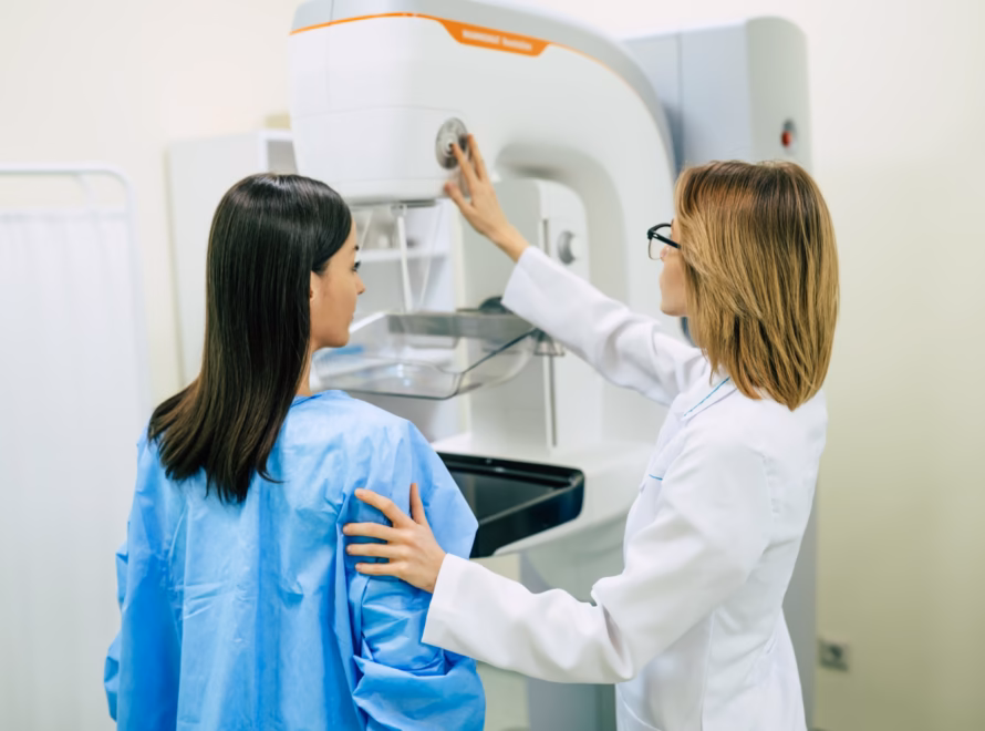 Patient getting ready for breast MRI scan with doctor support